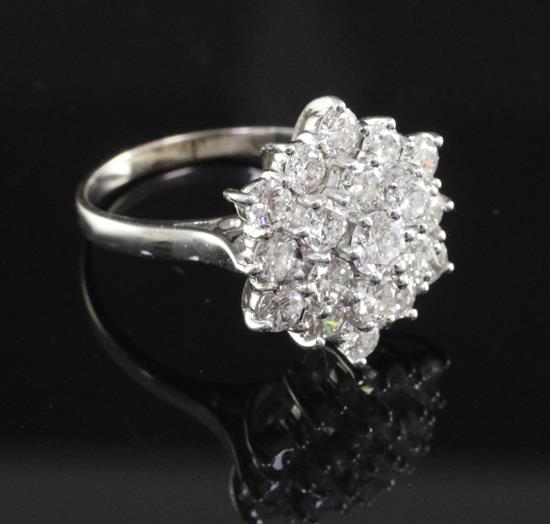 An 18ct white gold and diamond star shaped cluster ring, size M.